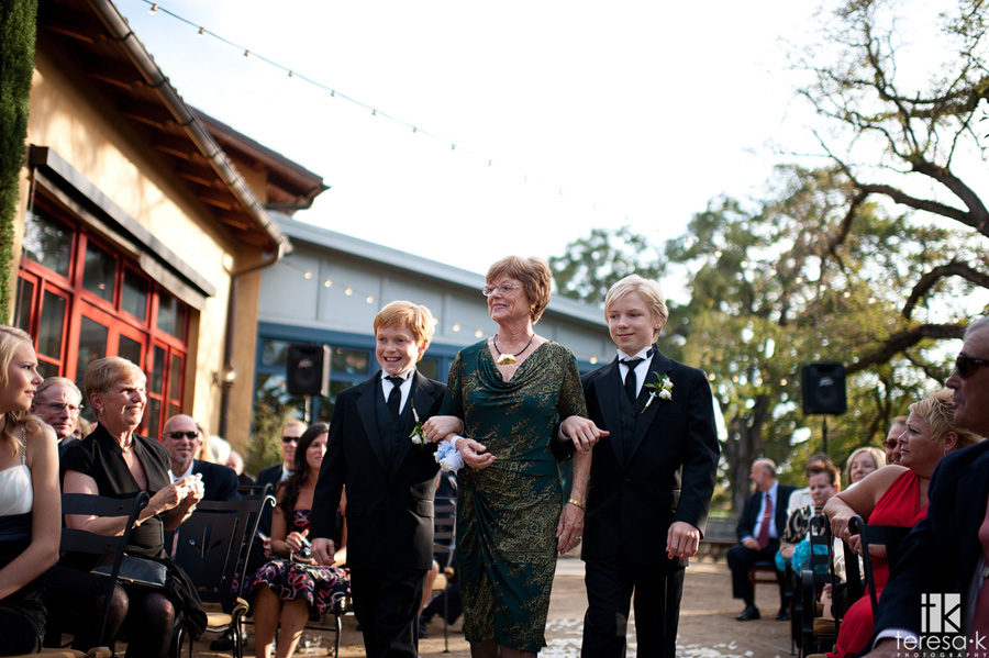 grandma walking her boys down the aisle