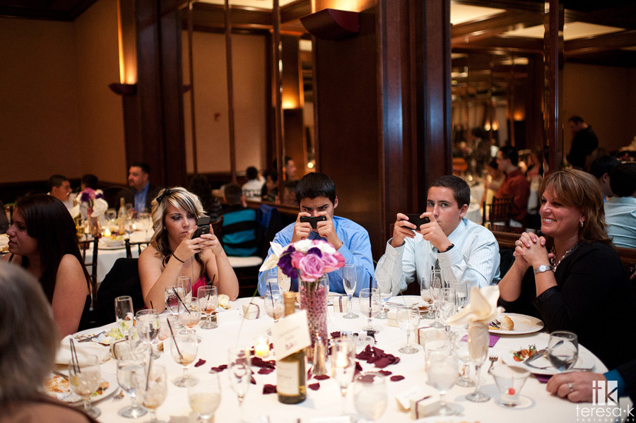 Arden Hills Resort Club Wedding by Sacramento Wedding photographer Teresa K kids texting at wedding reception