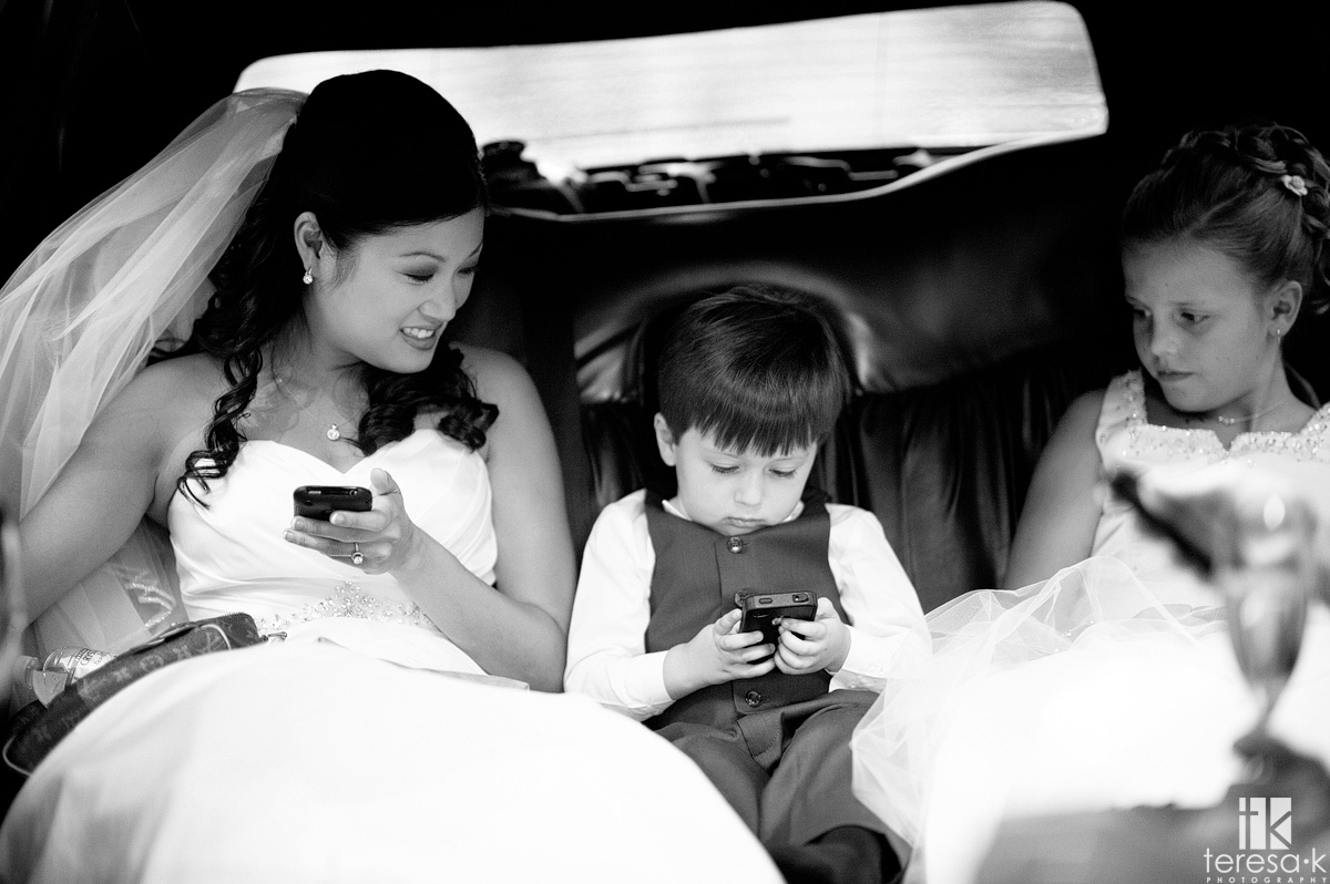 Sacramento area wedding and portrait photographer best of 2011 bride and ring bearer using phones
